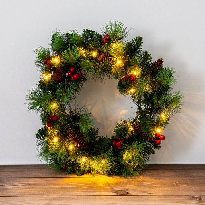 LED julekrans "Noel" udendørs dekoration lavet af metal og plast i grønt og guld, med fast installerede LED'er