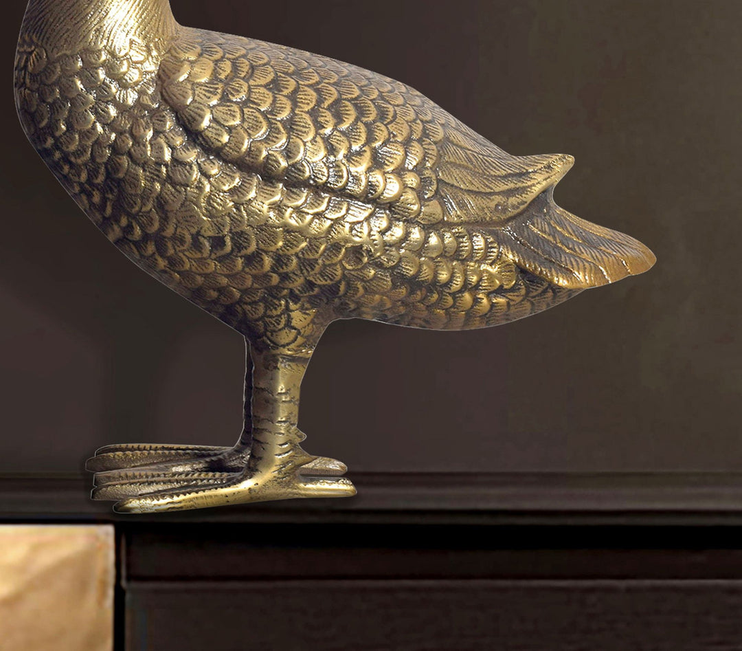 Dekorativ gåsefigur, aluminium, guld, 46 cm, boligindretning, borddekoration, moderne metaldesign, aluminiums borddekoration, boligindretning, dekorativt boligtilbehør