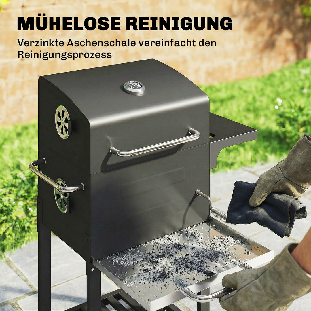 Kompakt kulgrillvogn med låg, termometer, grillrist, sidebord, askeskuffe og ventilationsåbninger.
