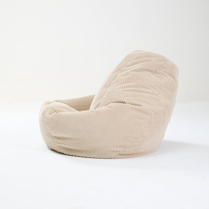 GRANA Beige fløjlsbøjlepuf til stuen