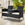 Polyrattan havebænk med bord sort 143x55x88cm