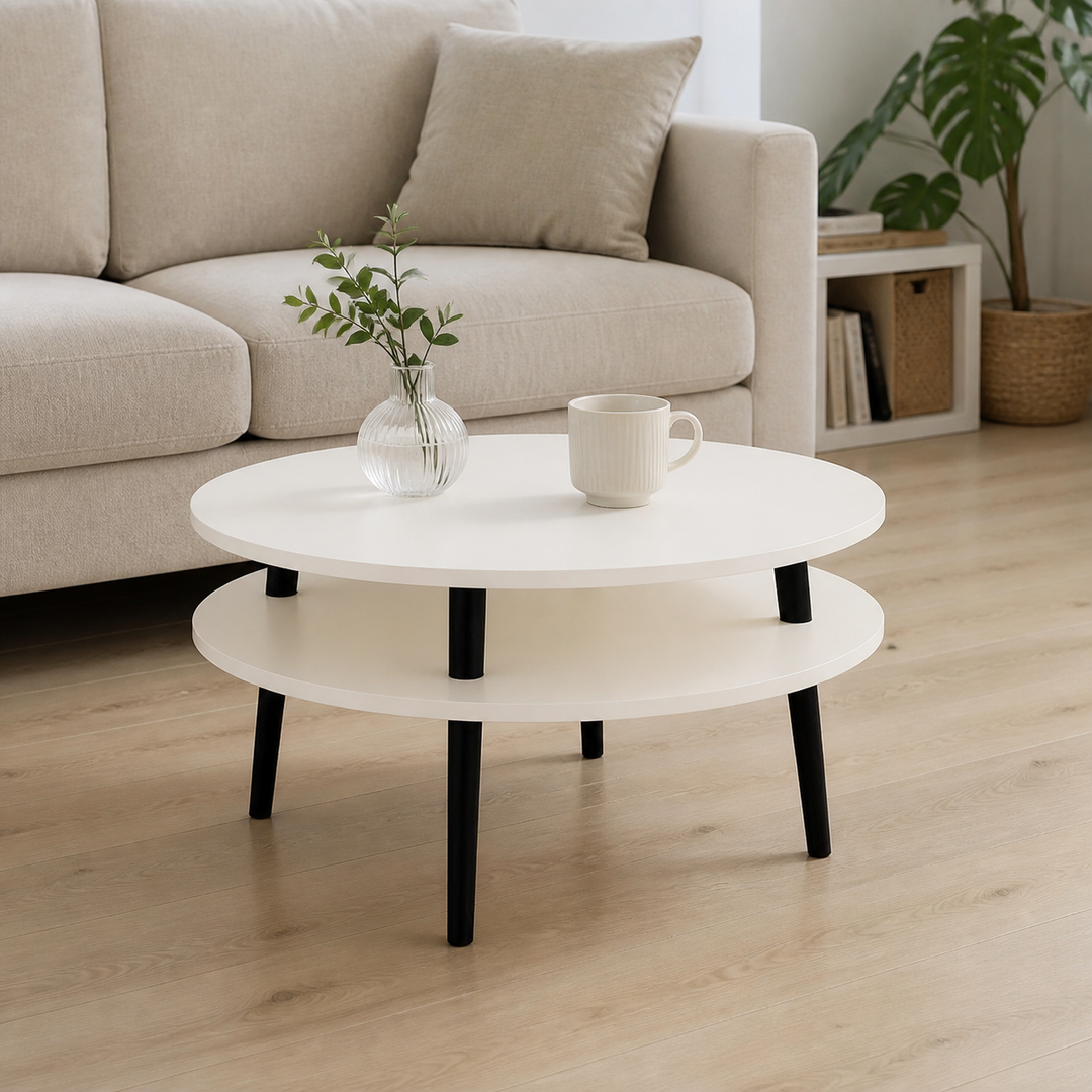 UFO Sofabord Diam 70cm x Højde 35cm Kridthvid med sorte ben – supplerende neutral dagslysscene