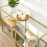Konsolbord i hærdet glas og med guldfarvet metalramme, art-deco-look